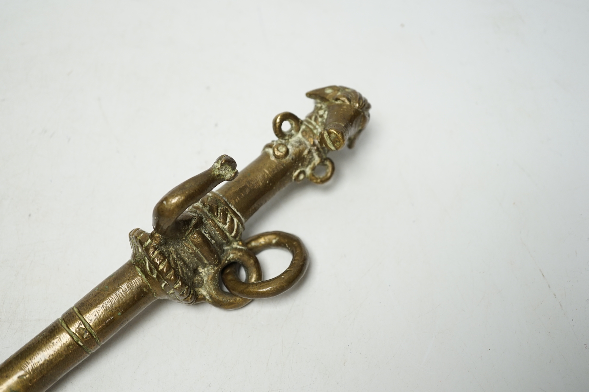 A Tibetan bronze goat tether, 39cm high